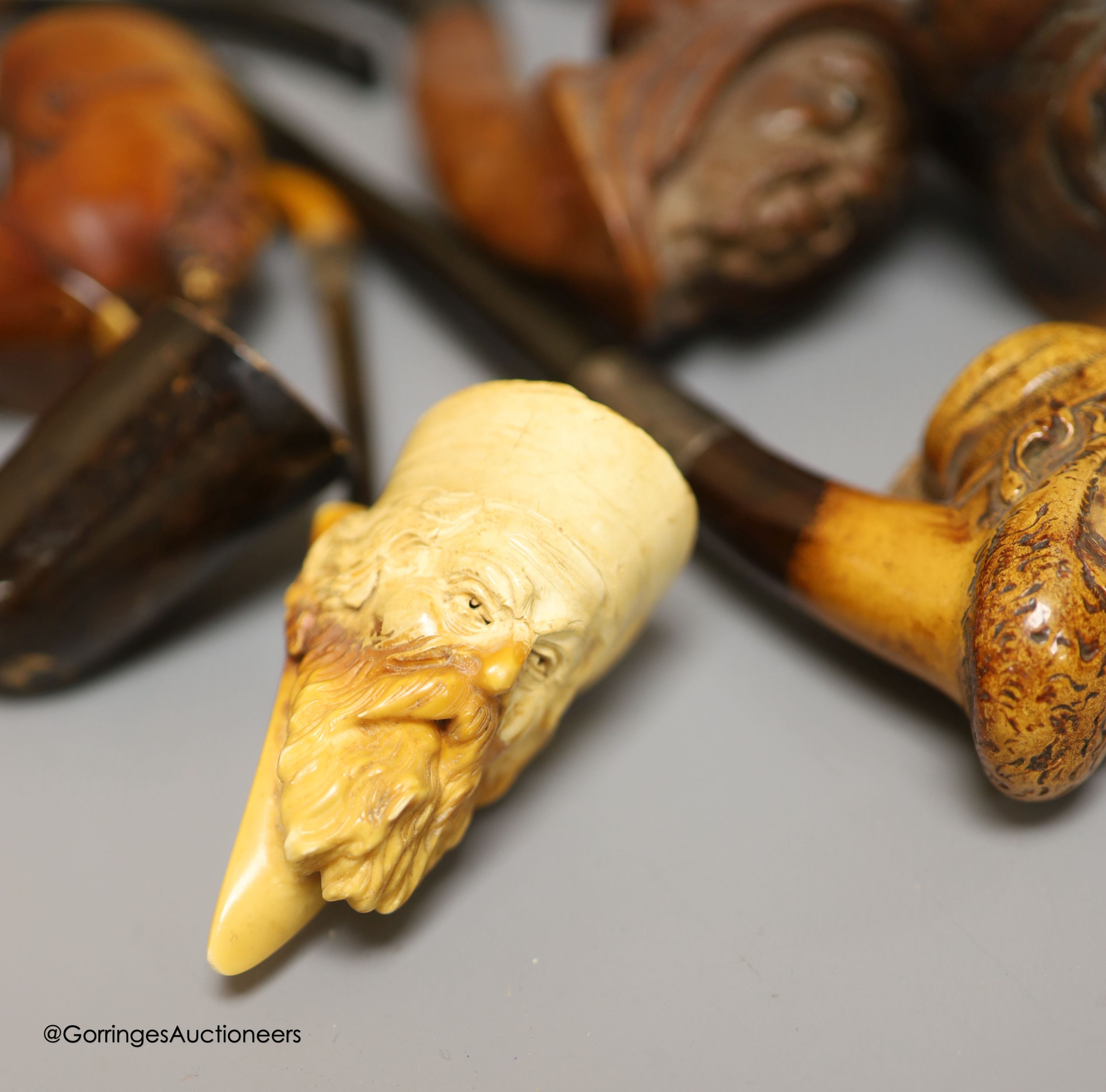An Inuit stone bear and a collection of Meerschaum pipes
